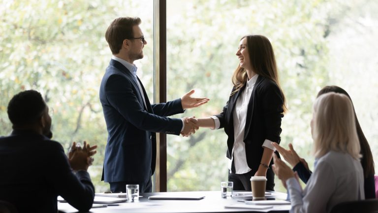 Business,Team,Leader,Congratulating,Employee,On,Hiring,,Promotion,,High,Work